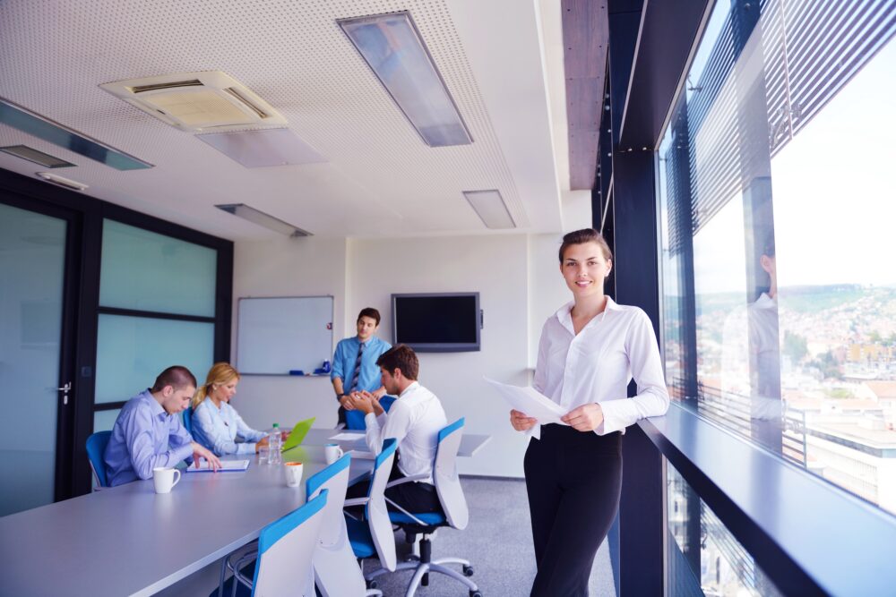 Group of happy young  business people in a meeting at office